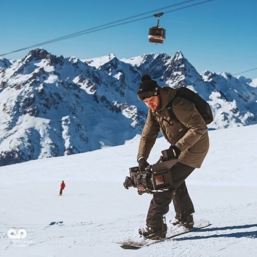 man-filming-skiing-corporate-videos
